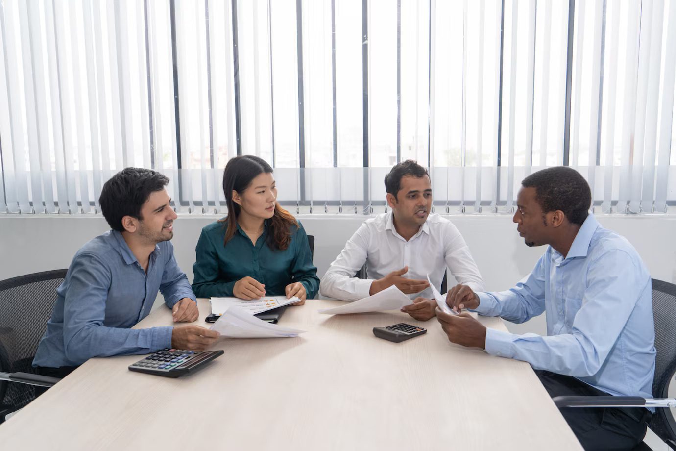 A group of people sitting around a table.