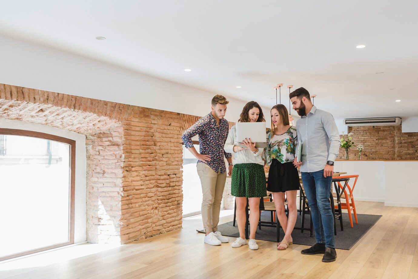 A group of people standing in a room.