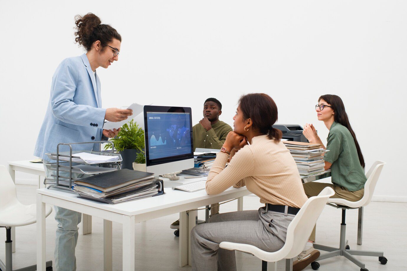 A group of people sitting around a table.