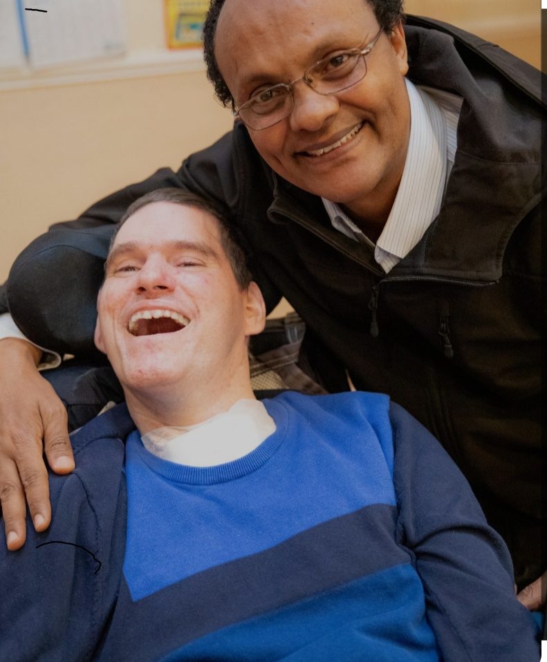 A man and woman pose for the camera.